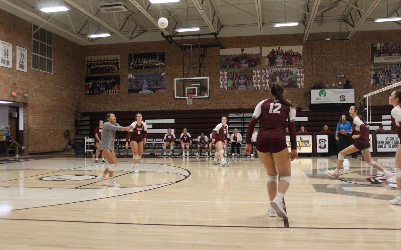 Lady Devils Izzy Walker (from left), Kennedy Anthony, Rylee Rawls and Carley Teesateskie watch the ball descend at the game Thursday, Sept. 21, in which they beat the Robbinsville Black Knights.