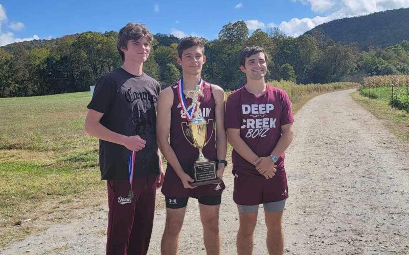 The top finishers for the boys are shown with the SMC trophy