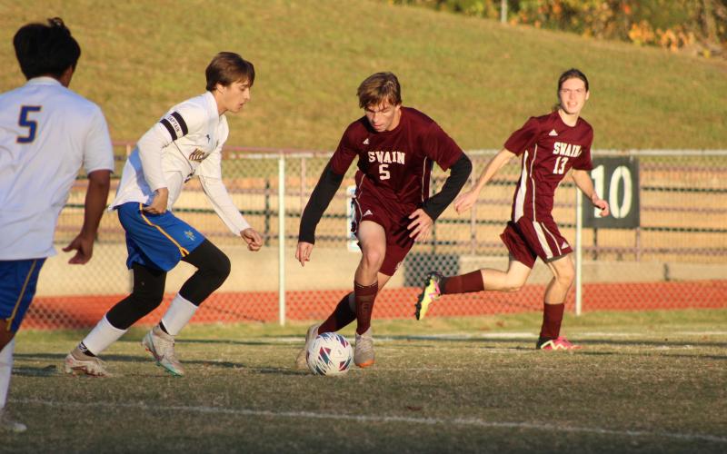 Brendan Lanning (from left) and McClane Whorton maneuver the ball around the field at the soccer game from Wednesday, Oct. 18.