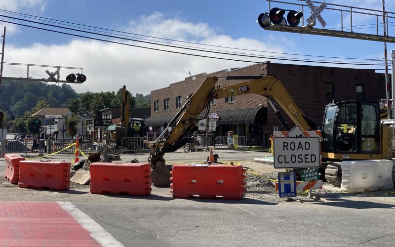 Contractors work on utility upgrades on Everett Street Monday morning.