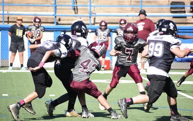 Swain Midget Malakii Otero, 11, prevents a Knights advance.