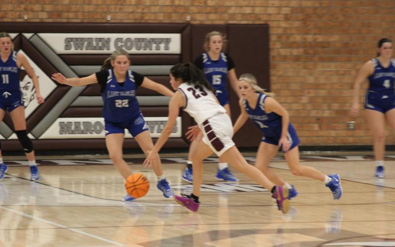 Sophomore Marlee Hicks prepares to shoot the ball at the game Tuesday, Dec. 5.