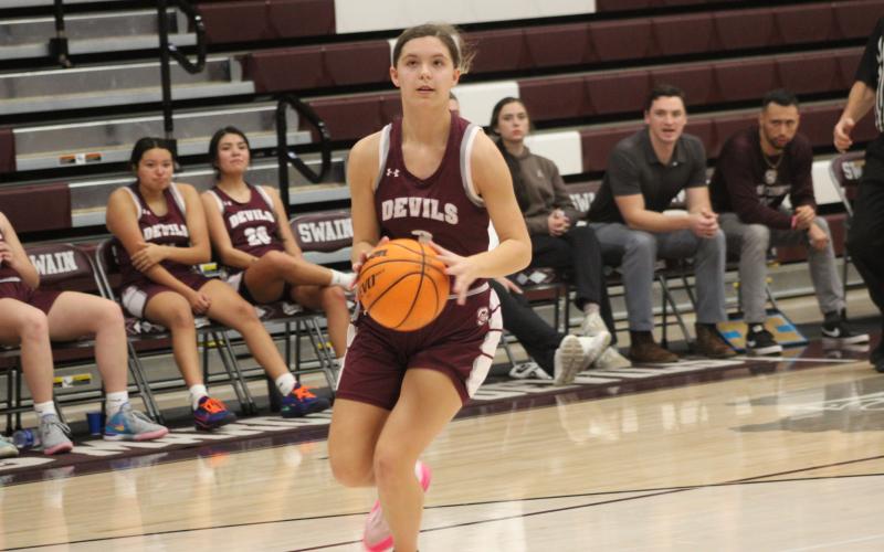 Lady Devil sophomore Jayden Smiley gets ready to shoot in the basketball game Dec. 28, which the Lady Devils easily won 70-20 over the Lady Black Hawks.