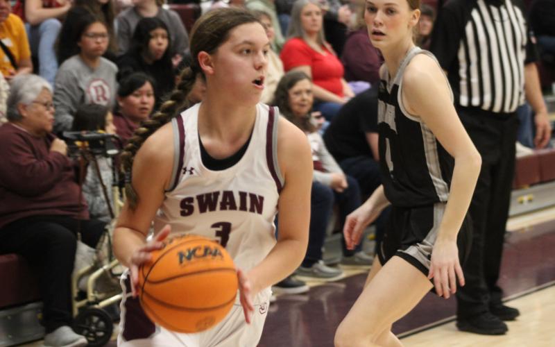 Sophomore Jayden Smiley takes hold of the ball at the game against the Black Knights at home on Friday, Feb. 9.