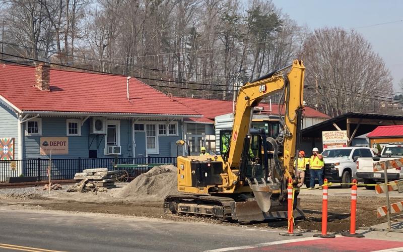 Contractors began work last week where a bus drop off will be constructed on Everett Street next to the train depot.