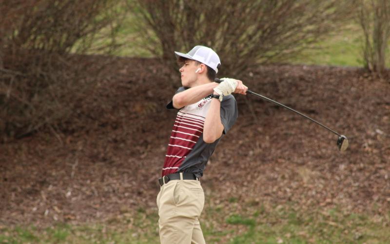 Maroon Devil golfer Jack Wilmont takes a swing at the game the Devils hosted at Smoky Mountain Country Club on Tuesday, March 5, where he scored 51 points overall.