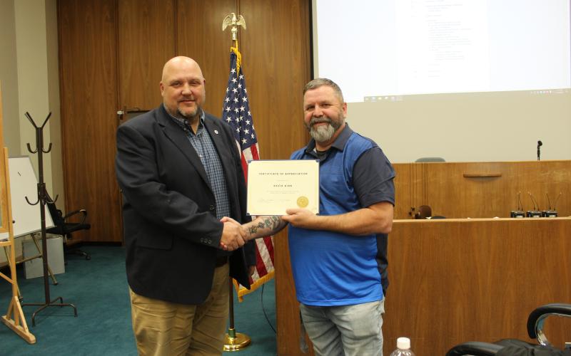 County Manager Kevin King (left) bid farewell to the county at the March 19 commissioners’ meeting. Commission Chairman Kevin Seagle presented him with a Certificate of Appreciation. King has worked for the county for 28 years. On April 1, he will start his new position as the county manager for Jackson County.