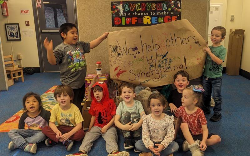 Members of the Student Lighthouse Leadership Group at Bright Adventures Pre-K put together all the goodies that students and families brought in for residents at Mountain View Manor. The Bright Adventures Service Learning Action Team helped students with this project. The students were excited about how well the school worked together to help some important people in our community. They learned that by SYNERGIZING they can do amazing things! Pictured: Sara Echeverria, David Ledford, Brantley Ensley, Jack St