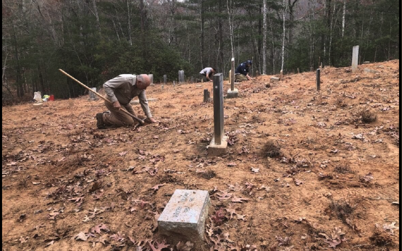 Henry Chambers with North Shore Cemetery Association is pictured at a workday at Fairview Cemetery last year.