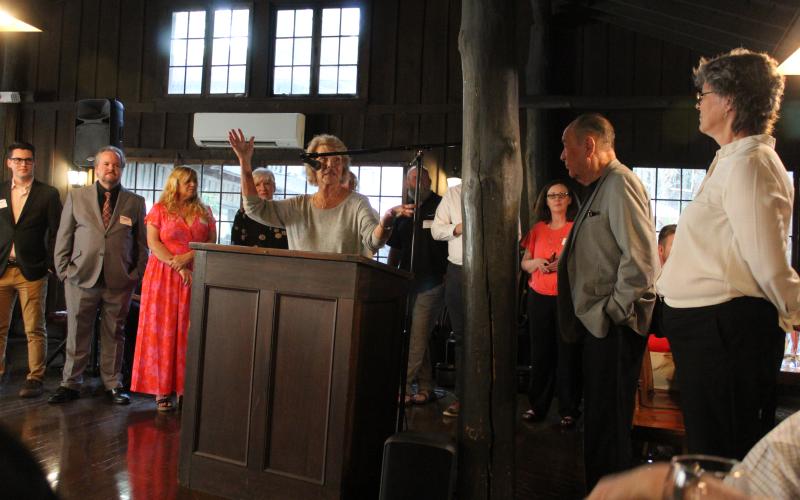 Sue Brown, co-owner operator of The Fryemont Inn, speaks to the crowd after she and her husband George were awarded the Duke Energy Service &amp; Citizenship Award.
