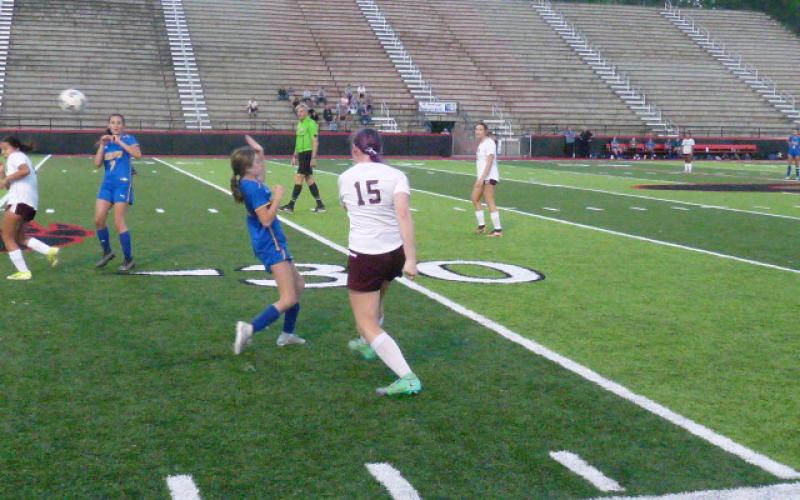 Player of the Game Karena Cline with a pass to Isabella Walker in the seeding victory.
