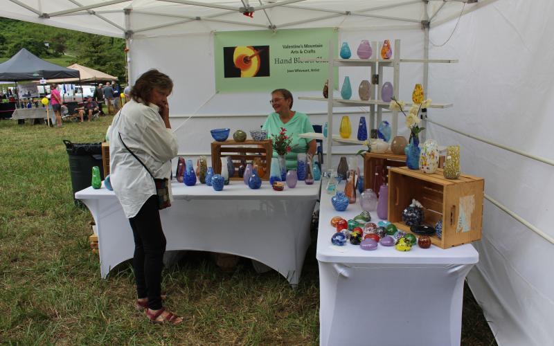 Jean Whisnant, glass blower who creates her work at the Jackson County Green Energy Park, had a variety of glass vases and other items for sale.