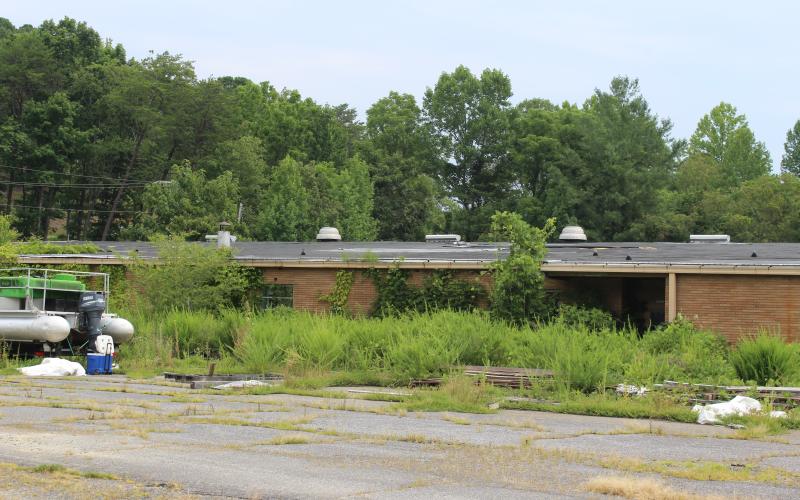 According to the county, the previous property owner is responsible for demolishing the old building on Black Hill Road where the school system plans to build a new middle school.