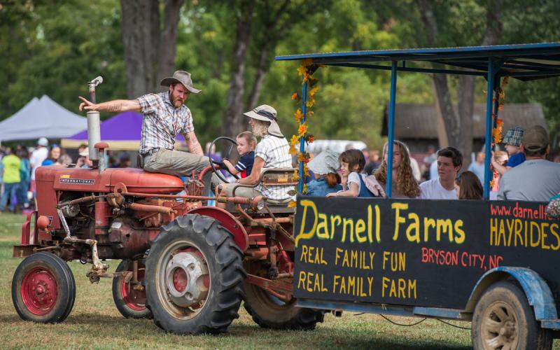 Darnell Farms, led by Nate Darnell (left) and sister Afton Roberts, is the recipient of the organizational Mountain Heritage Day award.
