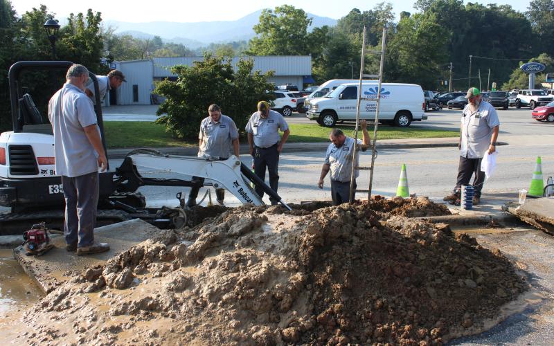 town public works department fix a water main break.