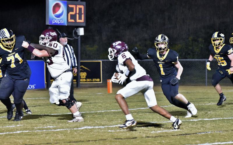 Maroon Devil Zeke Glaspie, junior, eyes the end zone in the away game against the Bulldogs.