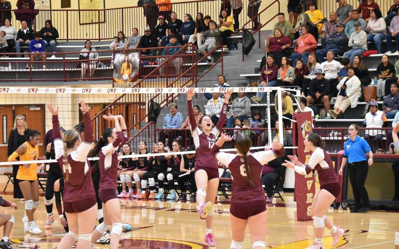The Lady Devils celebrate after a victory against Cherokee Lady Braves.