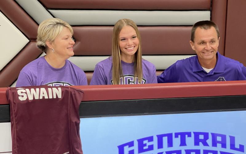Arizona Blankenship, a Swain High senior, signed her letter of intent to attend Central Arkansas University and run cross country and track in a ceremony at the Swain High gym on Friday, Nov. 15. She's pictured here with her parents, Sonya and Neil.
