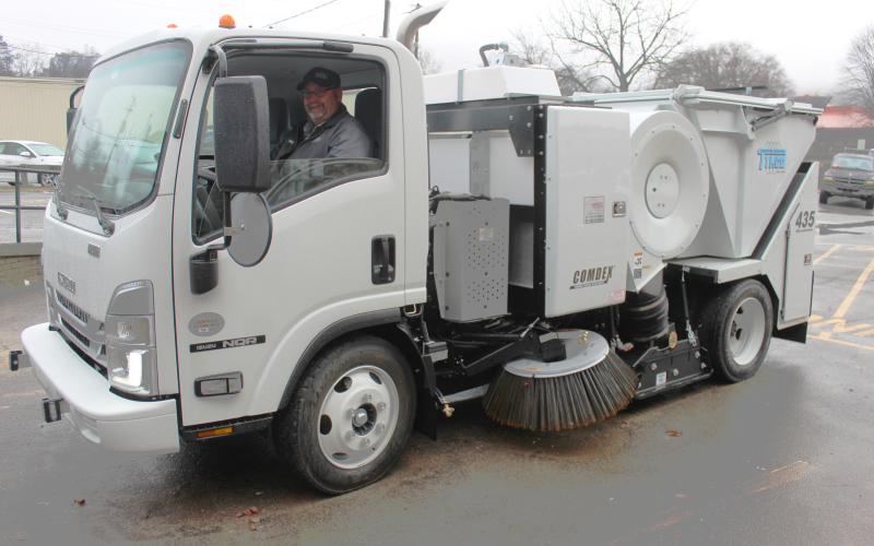 Mike Tabor, streets supervisor with Town of Bryson City, sits in the newly purchased Tymco street sweeper that will start serving the town in January.
