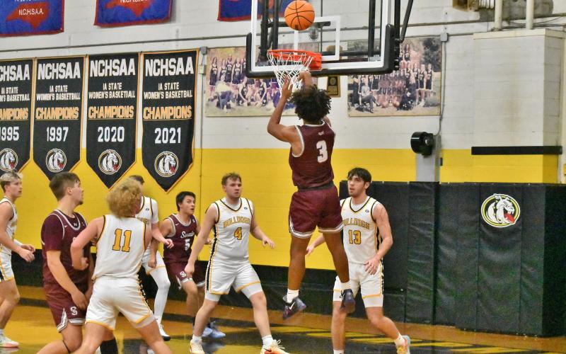 Devil Jayden Smiley delivers a basket in the away game against the Bulldogs, which ended in a 75-39 loss for the Devils.
