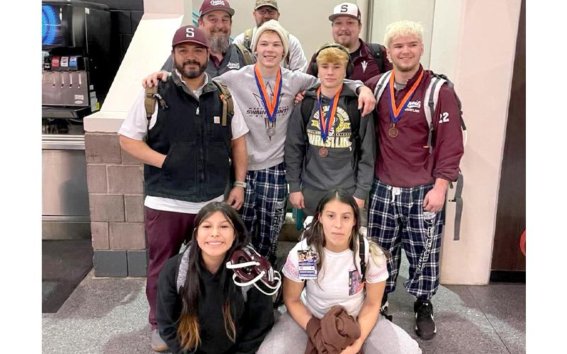 Swain sent two women and three men to the state wrestling championships this year. The athletes are pictured here with their coaches.