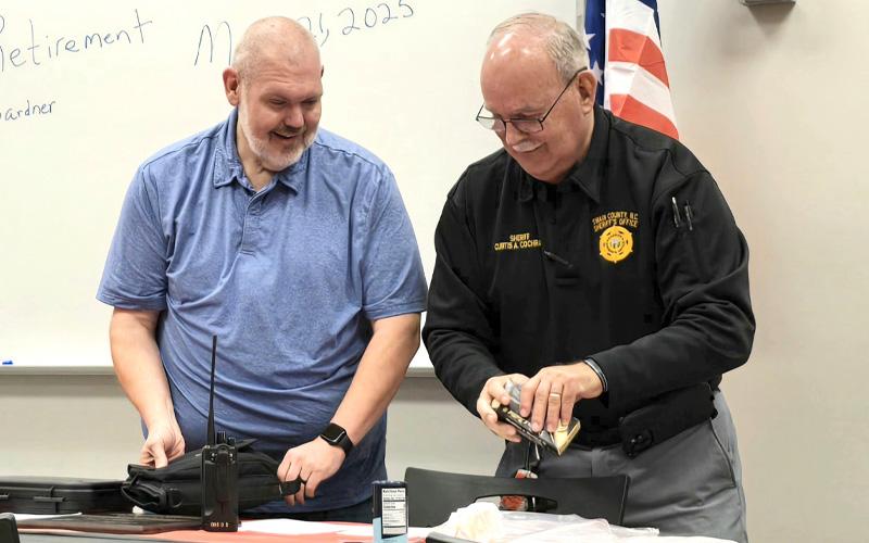 Swain County Sheriff Curtis Cochran presents Jason Gardner, Swain County Sheriff’s Office Chief Deputy retiree, with retirement gifts following 21 years of service to the county at the Business Education and Training Center on Friday, March 21. Prior law enforcement experience included serving with the Marion Police Department for five years and Belmont Police Department for another three years.