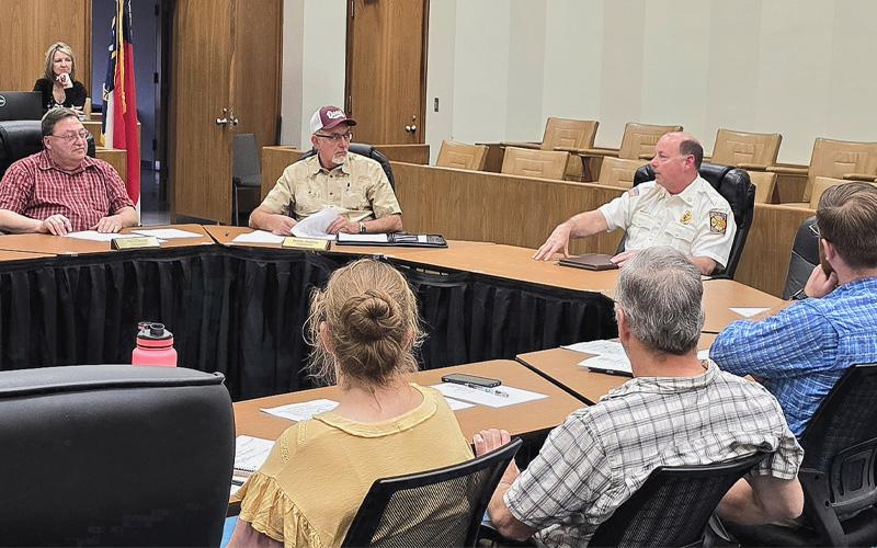 Photo/Sara Eisinger.  Bryson City Fire Department Chief Charles Bryson seeks funding to hire additional firefighters during a joint Swain County Board of Commissioners and Town of Bryson City Board of Aldermen work session at the Swain County Administration Building Thursday, March 13. Bryson asked that residents concerned about fire protection contact their any of their five commissioners.