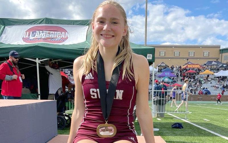 Annie Lewis earns the Running Events MVP Award during the prestigious Blue Ridge Classic at AC Reynolds High School April 4. Lewis won the 1,600 and 800-meter runs and finished second in the 3,200 during the event.