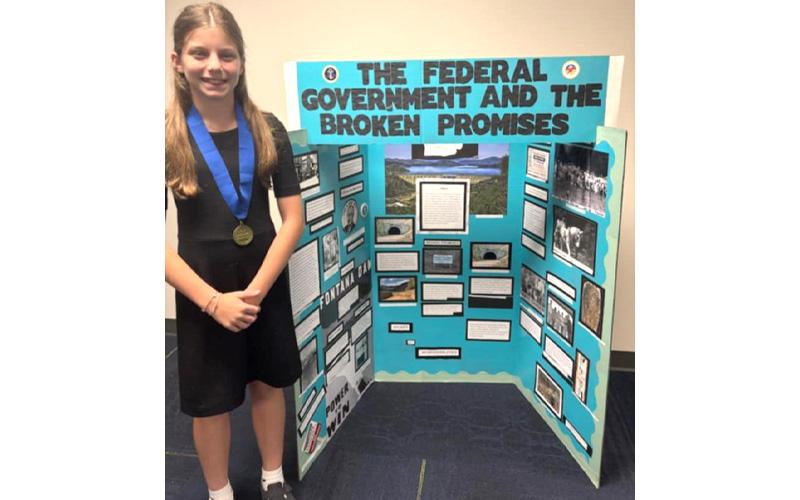 Submitted photo.  Sixth grade student Elsie-Mae Clayton earns first place for her ‘Federal government and the broken promises’ project in the individual exhibit category at the North Carolina State History Day competition at University of North Carolina Greensboro May 3. Clayton will represent Swain County in Washington D.C. where her work will be displayed at Smithsonian National Museum June 8-12.