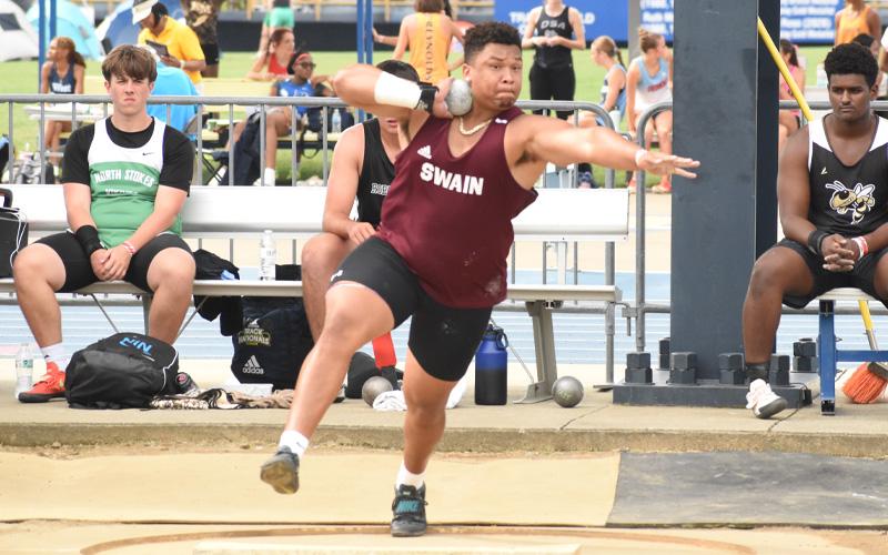 Submitted photo.  Nse Uffort steals the spotlight throwing the shot put 62-5.5 meters and discus 165-9 meters. Uffort has set a new all-classifications state meet record and named the Most Valuable Athlete of the state championship meet.