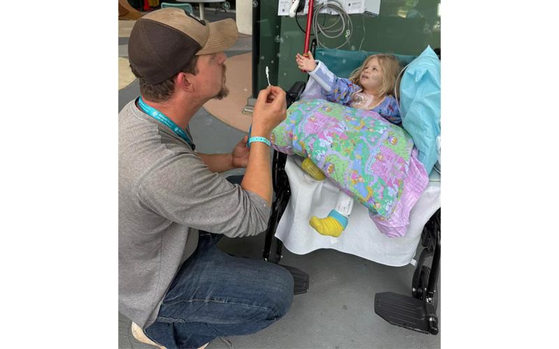 Photo/Kaci Ellis.  Tyler Ellis with his daughter, Lexi, right after surgery in April. A Take Down Cancer event to help fund the Ellis family will be held at Appalachia Training Center at 11:30 p.m. Saturday.