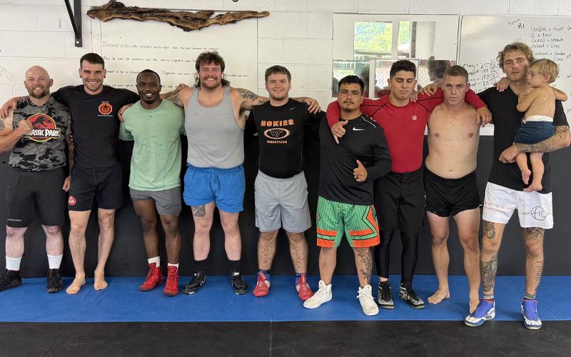 Photos submitted. Heavyweight group Creed Lovin (left to right), Landon Hunt, Marques Rand, Noland Brown, Clay Seagle, Tavi Rivera, Trent Torrence, Shawn Pearce, Graham Allen and Joseph Allen after competing in the Take Down Cancer Benefit at Appalachia Training Center Saturday, June 21. Approximately $2,600 for three-year-old Lexi Ellis of Cullowhee, who is undergoing chemotherapy.