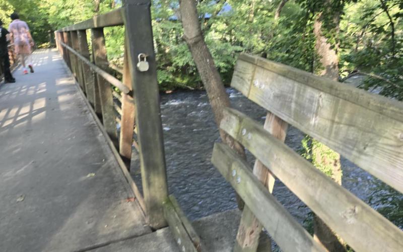 SMT photo/Sara Eisinger. A wooden guardrail at the Island Park bridge’s entrance pulled apart Saturday, July 5.