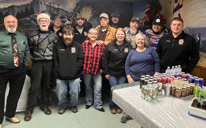 Submitted photo.  Kenny Ball (front, left to right), David Sawyer, Connor O’Donoghue, Camella Gibson, Melissa Ledford, Vida Cody, Daniel Bowers; Steven Howell (back, left to right), Josh Anthony, Kenny Gibson, Cameron Wiggins, Scott Cody and Derrick Ledford at Alarka Volunteer Fire Department in December 2024.