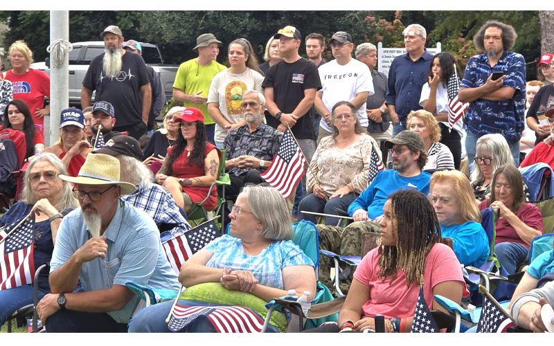 SMT photo/Sara Eisinger.  Charlie Kirk vigil attendees sing “Amazing Grace,” light candles, listen to the televised memorial and shared testimonies about the many ways Kirk touched their lives in Bryson City Sunday, Sept. 21.