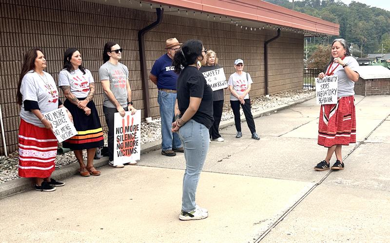 Submitted photo.  Qualla Boundary Missing Murdered Indigenous Women protestors stand together in silence as former Swain County Sheriff Curtis Cochran enters Swain County Courthouse Wednesday, Sept. 24.
