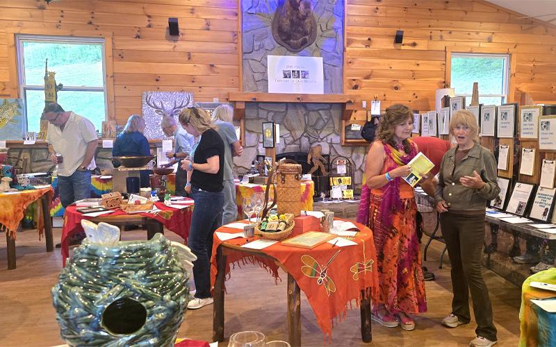 SMT photo/Sara Eisinger. P.A.W.S. Animal Shelter raises approximately $20,189 during its annual P.A.W.S. Wine Tasting fundraiser at Lands Creek Log Cabins Saturday, Aug. 30. A total of 95 businesses and individuals donated money and auction items to the cause.