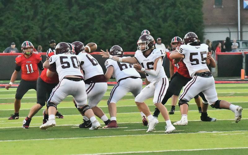 Photo/Joanna McMahan.  #16 Druw Cody tosses a shuttle pass behind the offense line at Pisgah HS Aug. 29. Cody finished 13-of-17 for 101 yards, and carried the ball 15 times for 67 yards.