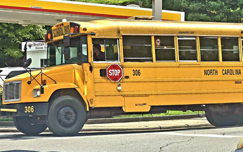 SMT photo/Sara Eisinger.  A school bus driver takes students home Aug. 18. Swain County Public Schools is facing a school bus shortage.