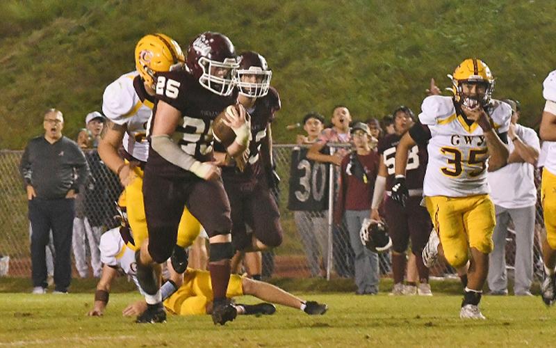 Photo/Joanna McMahan. #25 Colton Shuler breaks the Cherokee line for a 50-yard run in the fourth quarter, October 17.  The Swain offense had success on the ground all night by running for 401 yards.  