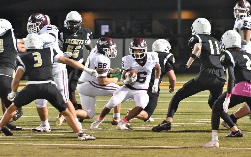 Photo/Joanna McMahan.  #6 Zeke Glaspie breaks the Yellow Jacket line in the win over Hayesville, October 10.  Glaspie would rush for 131 yards in the game.  