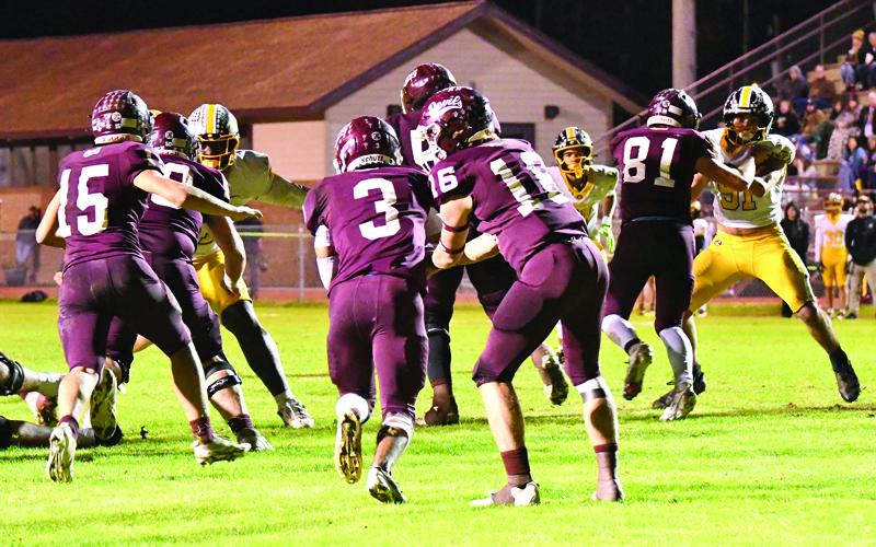 Photo/Joanna McMahan.  #16 Druw Cody hands off to #3 Kaden Sawyer behind the blocking of #15 Blake Lambert and #81 Noah Lossiah.