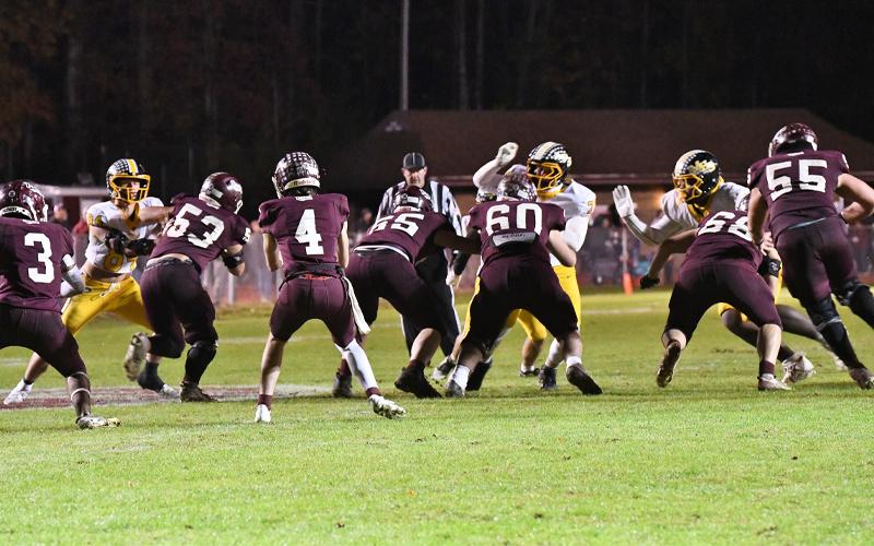 Photo/Joanna McMahan.   Oct. 31, 2025, Murphy at Swain.  The Swain offensive line (#53 Trent Jones, #65 Bruce Robertson, #60 Ayden Smiley, #68 Hunter Williamson, #55 Drew Scaggs) is working against Murphy on a give from #4 Ayden Kirkland to #3 Kaden Sawyer. 