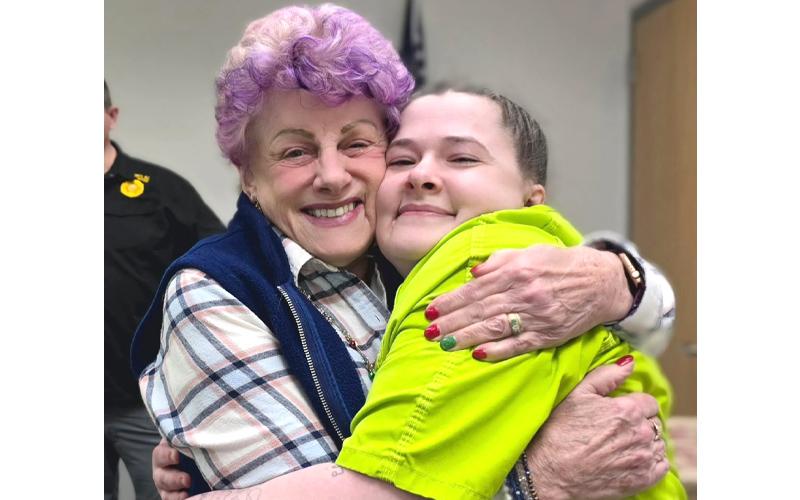 SMT photo/Sara Eisinger.  Kaye McConnell congratulates Chasity Taylor, who just earned a certificate of completion from Sunrise Community for Recovery and Wellness, with a big hug Dec. 18.