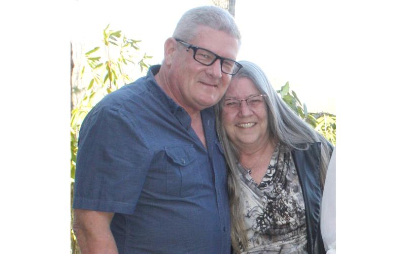 Photo submitted.  Roger Milsap holds his wife, Tammi Rothrock close at a friend’s wedding in Bryson City in March 2025.
