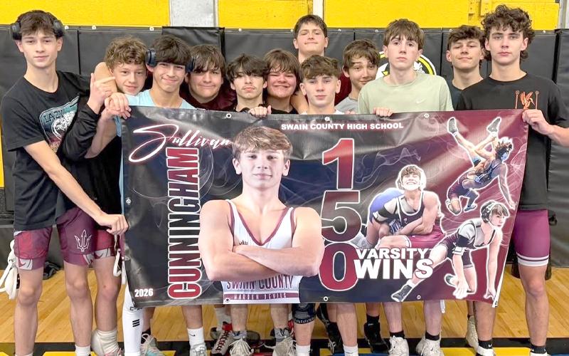 Submitted photo.  Rickie Antes (left to right), Oliver Millsaps, Seaborn Bradley, Hunter Williamson, Deagon Ledford, Mijo Salinas-Wike, Bruce Robertson, Sullivan Cunningham, Conner Walls, Loudon Crisp, Sawyer Cochran and Kobe Mashburn celebrate at Murphy High School in the Boys Smoky Mountain Conference Dual Team Championships Saturday. The Devils finished 3-3 for the day, earning wins over Rosman and Andrews, along with a 36-35 victory over Cherokee.
