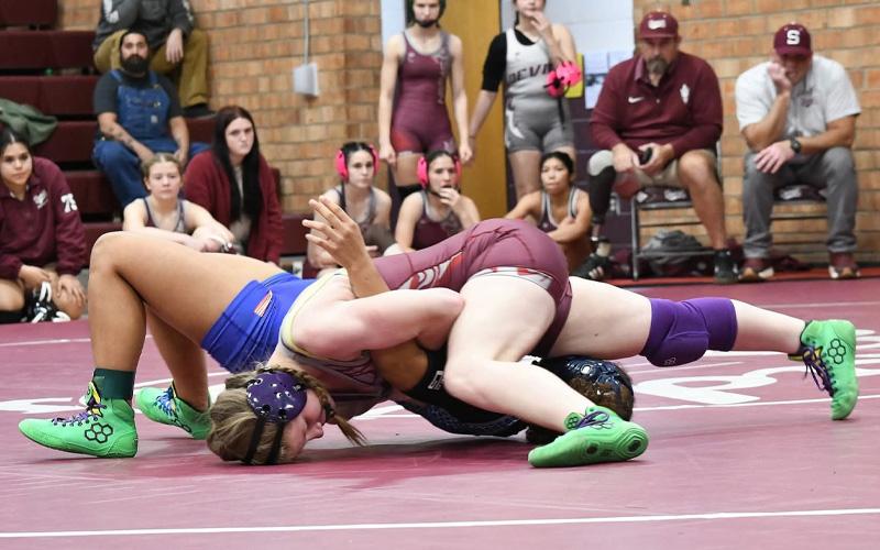 Submitted photo.  Claire Ball pins opponent at East Henderson High School Jan. 13.