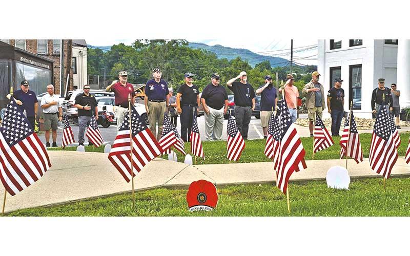 Veterans line up to honor the men and women who gave their lives in service to the nation at the veteran’s monument outside Swain County Visitor Center and Heritage Museum on Memorial Day, May 25.