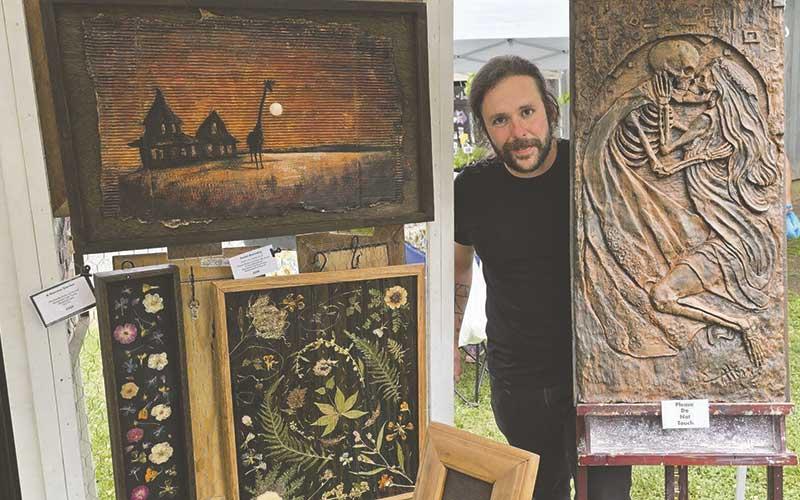 Erich Atkins of Von Fader Studios showcases copper relief art at Smoky Mountain Farmers and Artisans Market May 22.