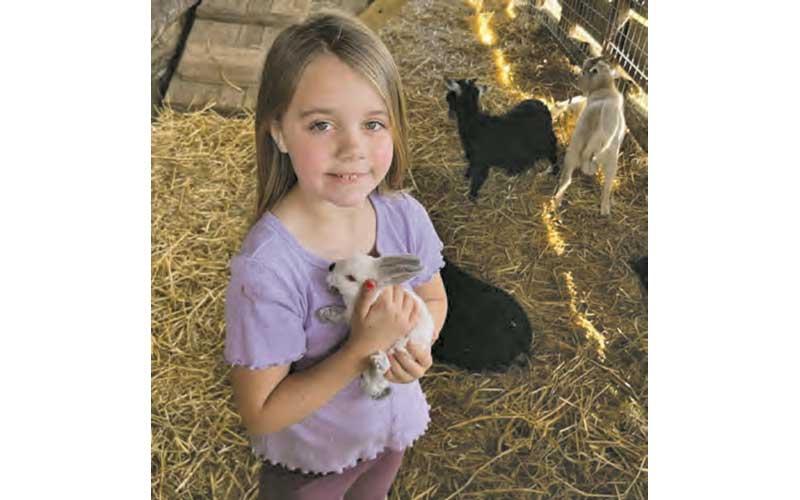 Photo submitted - Peyton shows off her family’s petting zoo in March 2023.